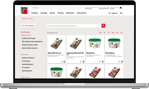 **Bildbeschreibung:**

Ein moderner Laptop zeigt die Website einer IT-Agentur, die spezialisiert auf den Verkauf und die Beratung von Baustoffen ist. Auf dem Bildschirm sind Produktbilder von verschiedenen Bauprodukten zu sehen, präsentiert in einem struk