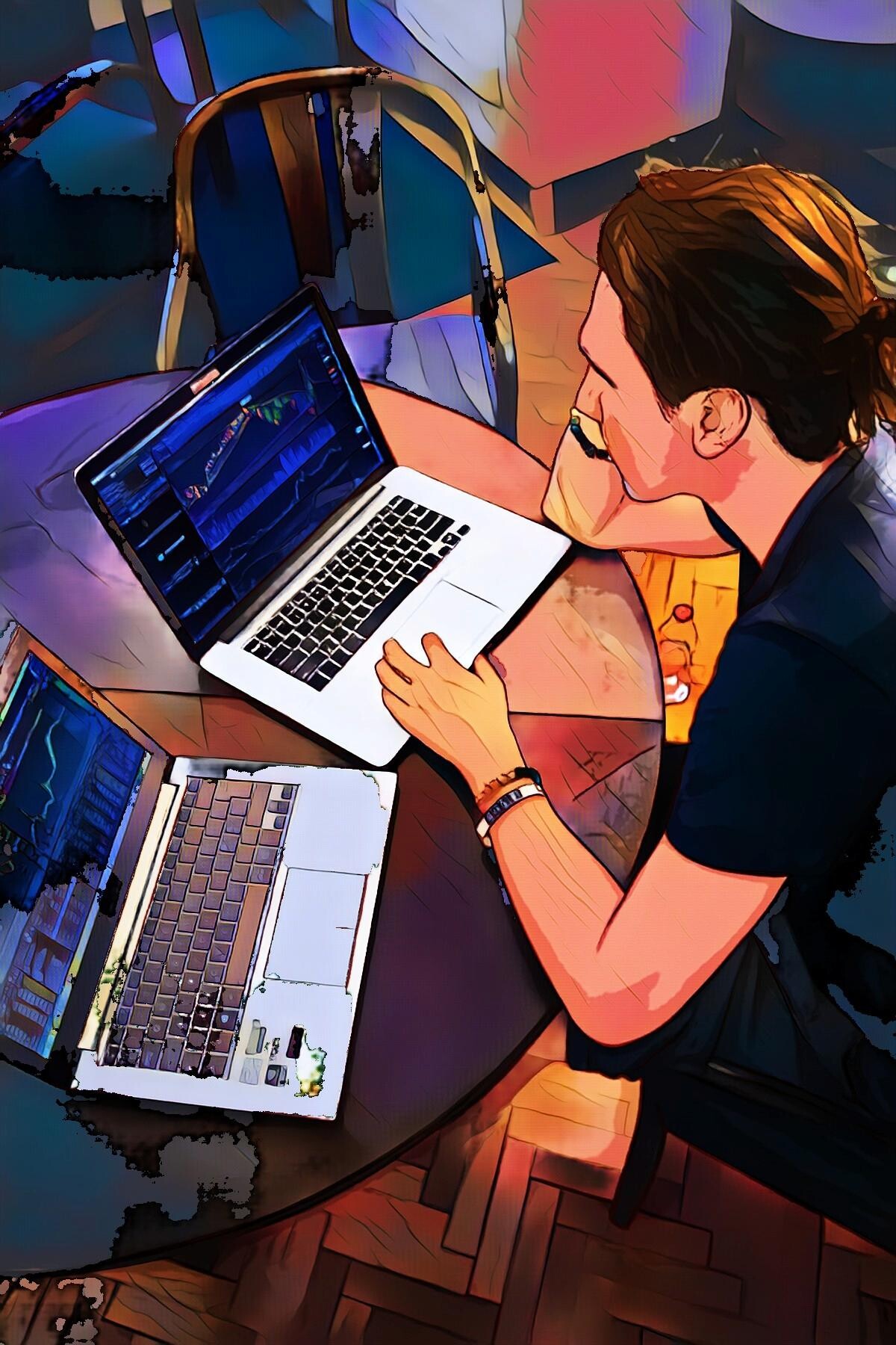 Person arbeitet an zwei Laptops mit Grafiken und Daten in künstlerischer Darstellung.