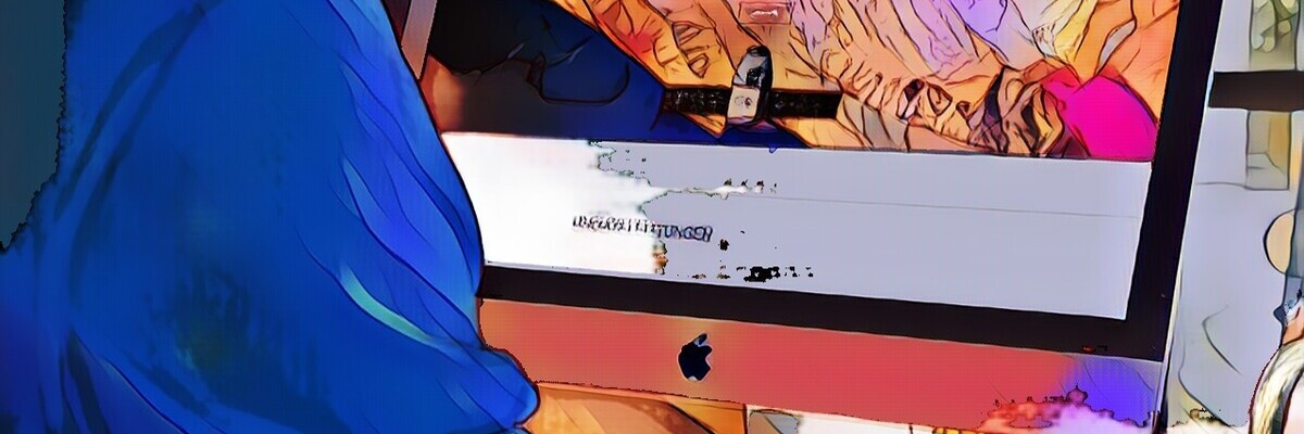 Person am Computer mit farbenfrohem Bildschirm, darauf ein Kunstdesign mit der Aufschrift "WE MAKE MOVES".