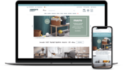 Laptop und Smartphone zeigen eine Webseite für Möbel und Wohnaccessoires mit modernem Design.